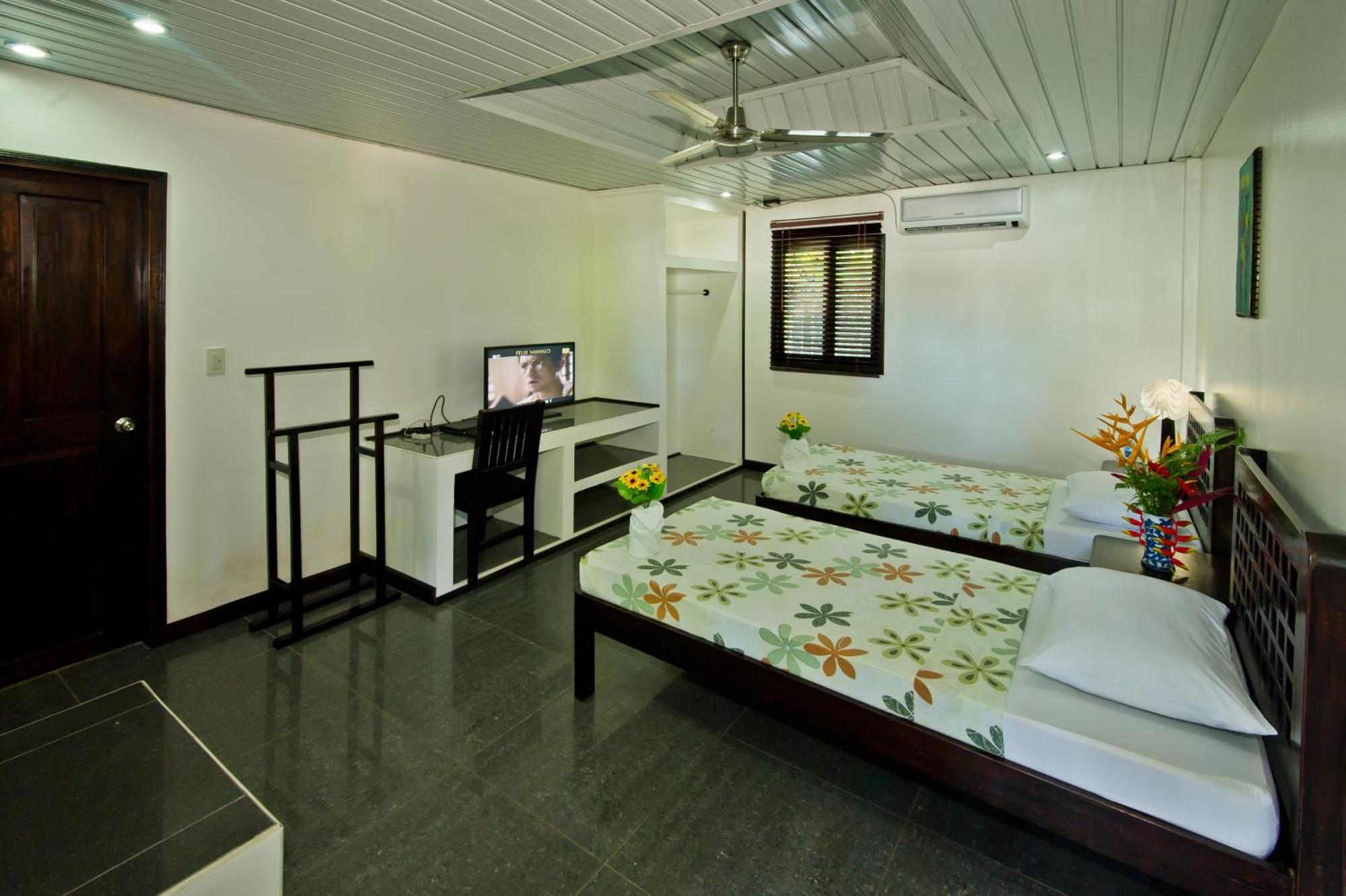 Balay Tuko Garden Inn Puerto Princesa Номер фото